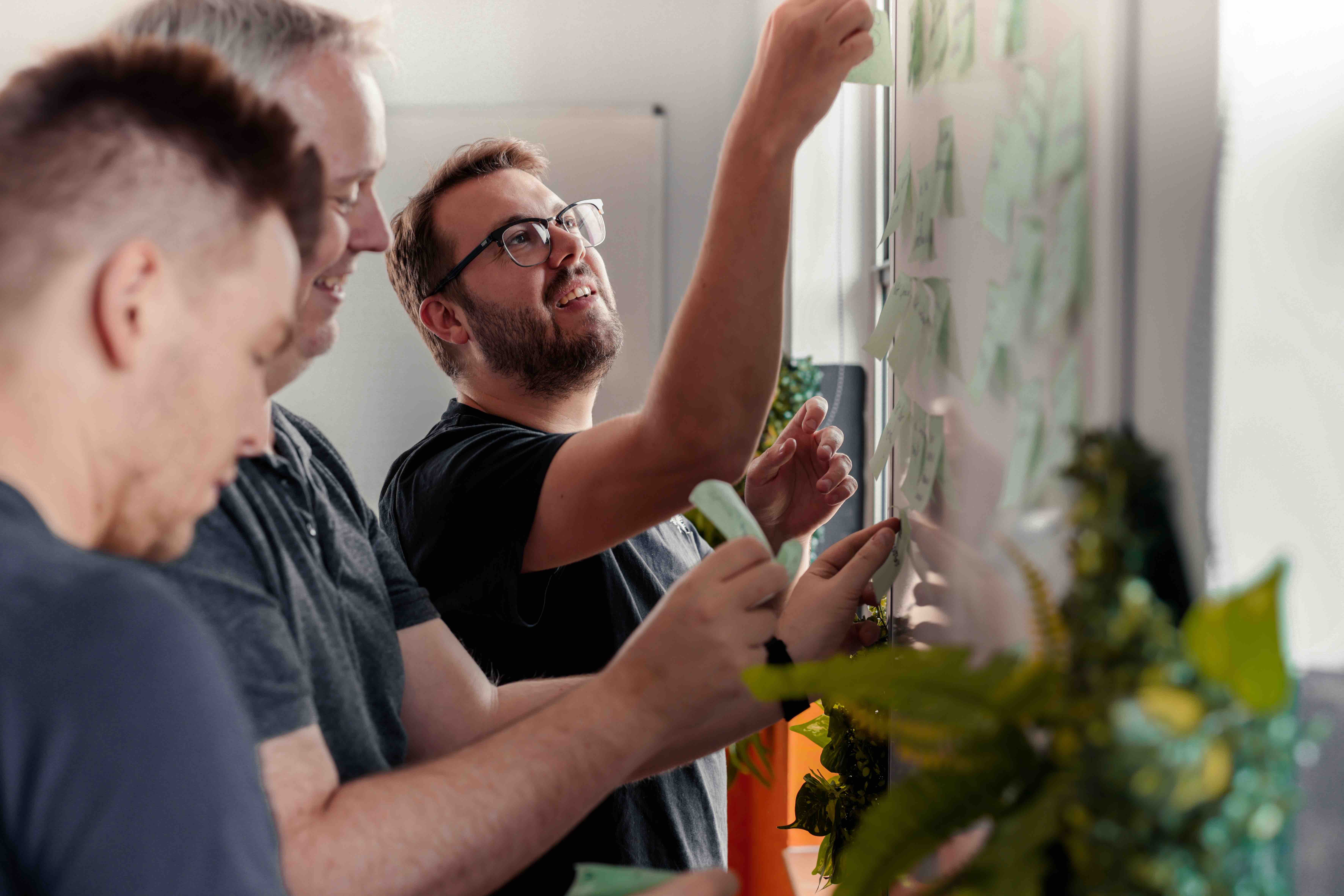 photo of our team doing a decision sprint with sticky notes